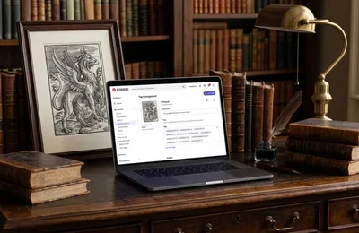 A dark academia workspace with a laptop showing Redbubble tag management interface, surrounded by antique books and a woodcut engraving print